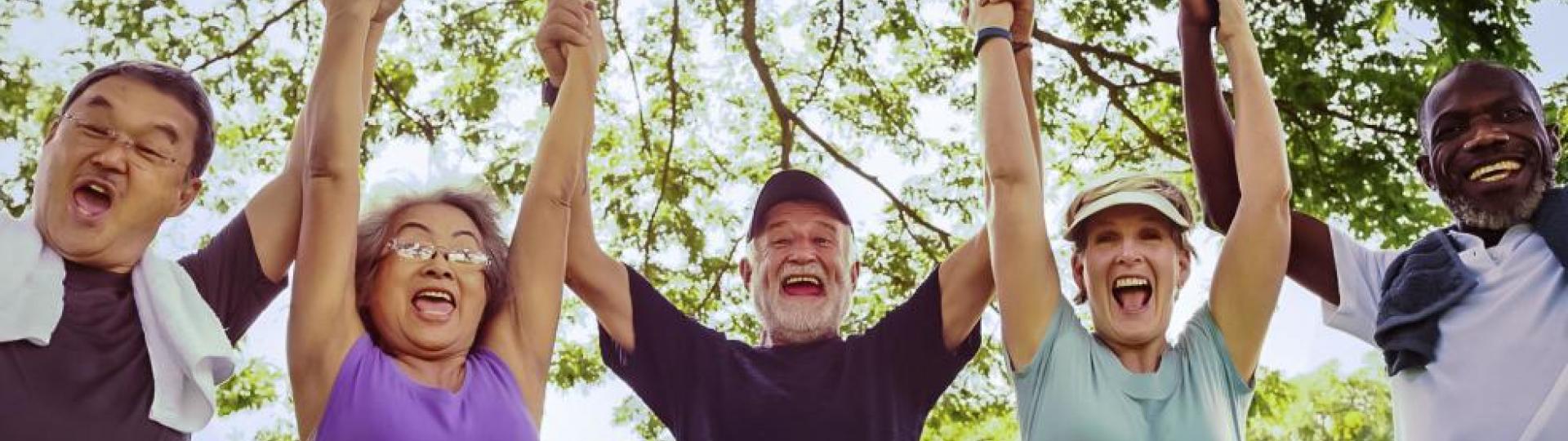 Image of senior friends being active and exercising in a park